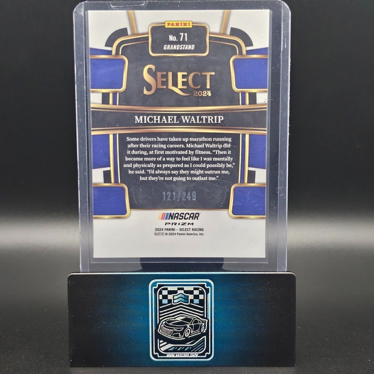 2024 Panini Select - Grandstand Red and Blue Prizm #71 Michael Waltrip /249 - NASCARD.shop