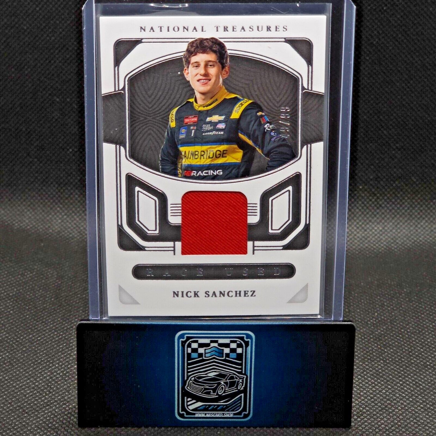 2023 Panini National Treasures Race Used Firesuit #RU-NSZ Nick Sanchez 49/99