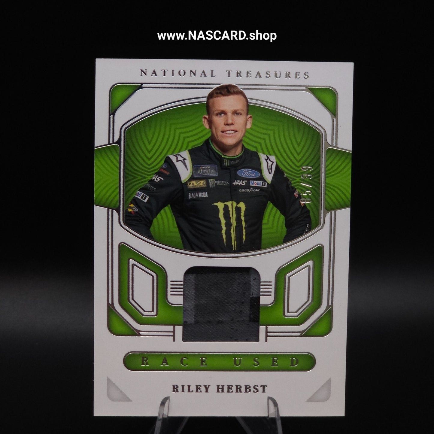 2023 Panini National Treasures - Race Used Firesuit Riley Herbst /99 (MEM)